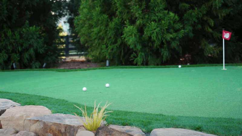 golf balls sitting on backyard putting green