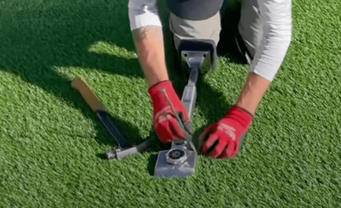 fake turf installation with tools
